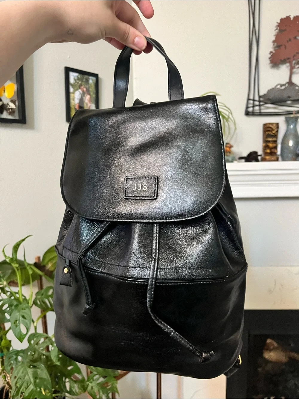 JJs House Black Leather Drawstring Flap Backpack
